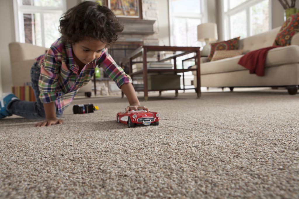 kid playing on carpet | A & M Flooring And Design